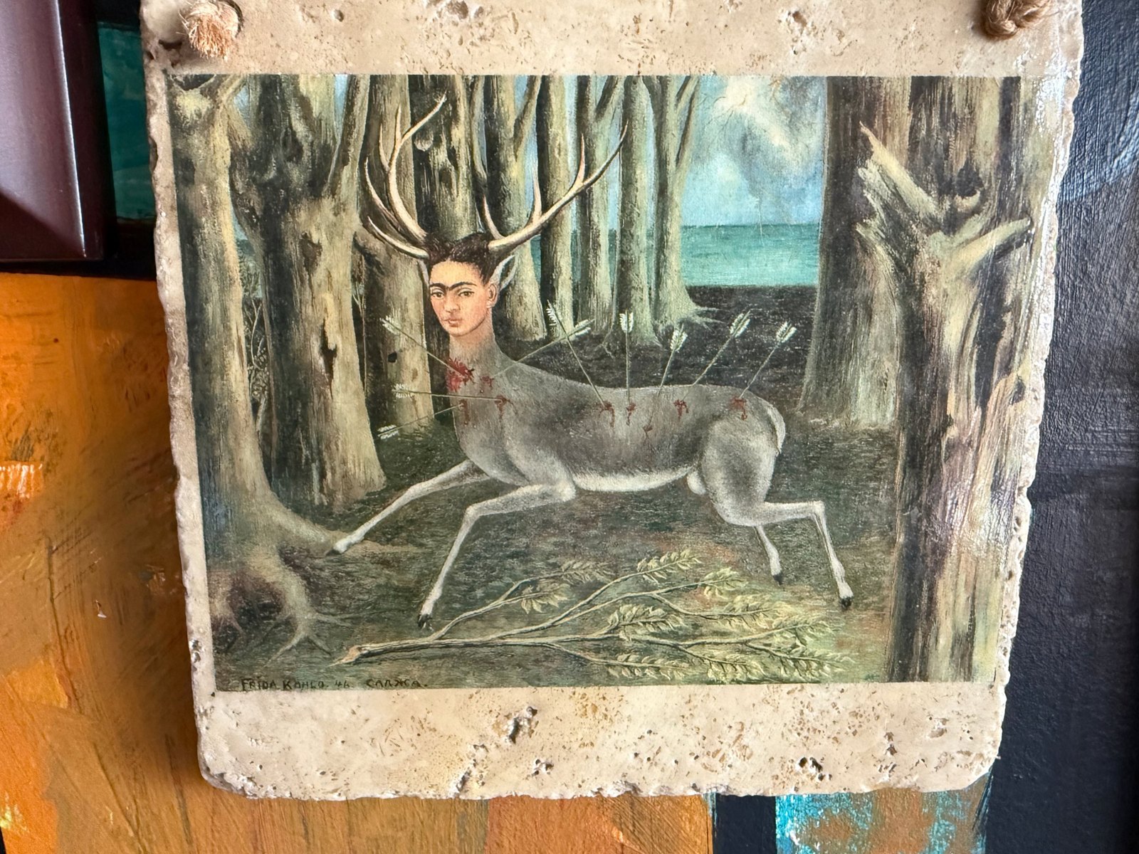 Lot 211, printed reproduction of Frida Kahlo’s The Little Deer on a travertine stone tile
