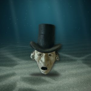 Lot 129 — Top Hat Face, Cast Iron Wall Piece